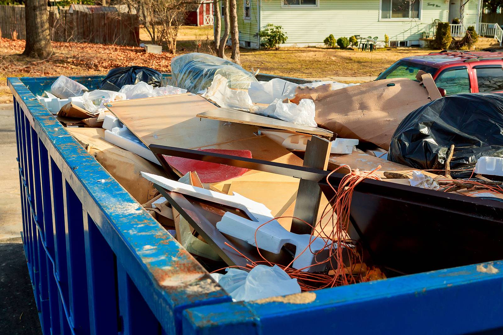 overflowing dumpster being full with garbage