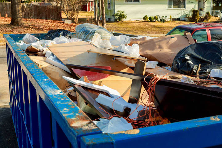 overflowing dumpster being full with garbage